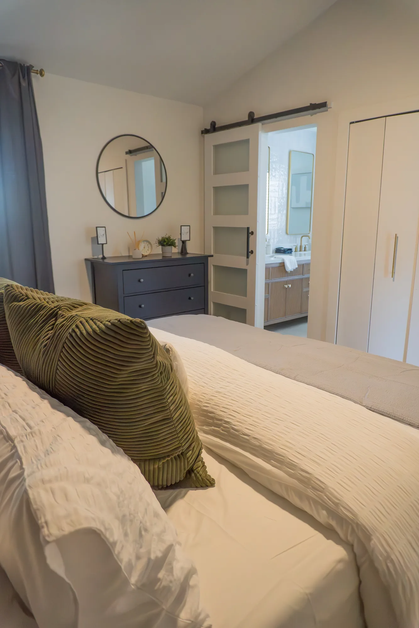 Bedroom with barn door to en suite bath